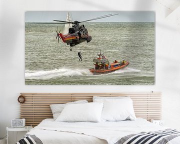 Dutch lifeboat and Belgian Sea King helicopter by Roel Ovinge