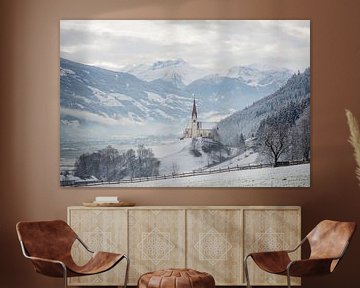 Church in alpine Zillertal valley in winter by iPics Photography
