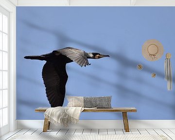 Aalscholver vliegend blauwe lucht van Sascha van Dam