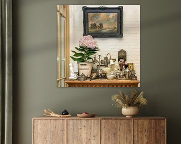 table with antique things and a hydrangea by Hanneke Luit
