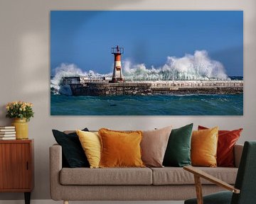 Lighthouse on pier with high waves