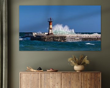 High waves beat against lighthouse by Inge van den Brande