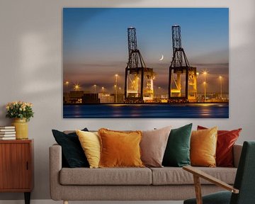 Industrial cranes in a port at sunset by Marcel van den Bos