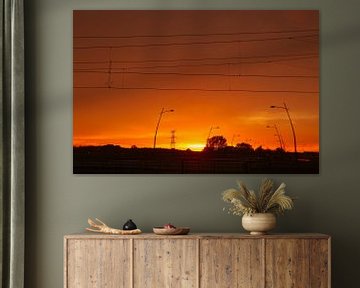 Sunset over the road and railway line von Vincent van der Tuin
