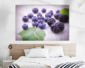 Fresh wild berries on the table by Tanja Riedel