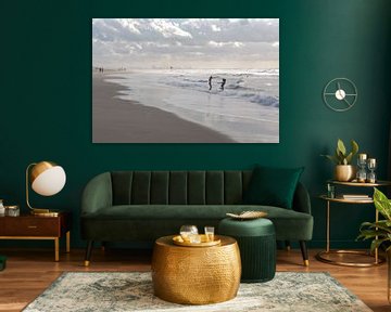 Two girls run into the sea at Scheveningen by Remke Spijkers