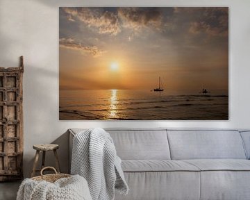 Beautiful dusk on the beach and silhouette of fishing boat and sailing boat by Tjeerd Kruse