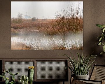 Windmolens aan de Kinderdijk in de mist