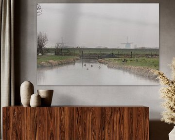 Zicht op de kinderdijk windmolens. by Brian Morgan