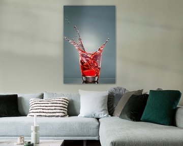 Splashes from a glass of red liquid by Wijnand Loven