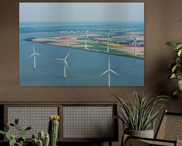 Aerial view of wind turbines on the coast in front of various colors o by Sjoerd van der Wal