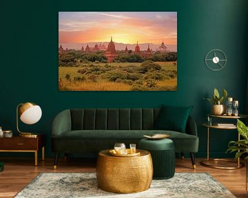 Ancient pagodas in the landscape near Bagan in Myanmar Asia at sunset by Eye on You