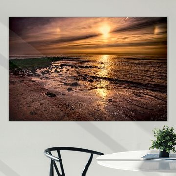 Zonsondergang aan zee