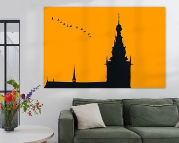 Nijmegen in avond oranje, met vlucht ganzen