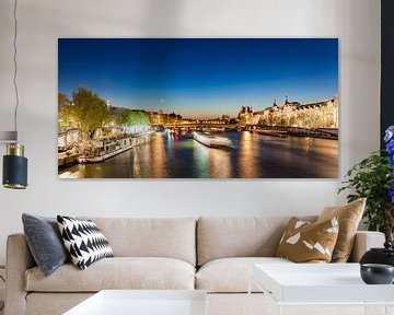 Excursion boats on Seine River in Paris at night by Werner Dieterich