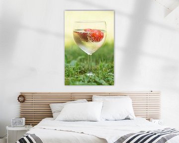 A glass full of summer (cocktail of wine and a strawberry in glass with drops) by Birgitte Bergman