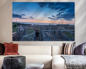 Kijfhoek marshalling yard with freight trains at sunset by Arthur Scheltes