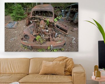 Car cemetery in forest in Ryd, Sweden by Joost Adriaanse