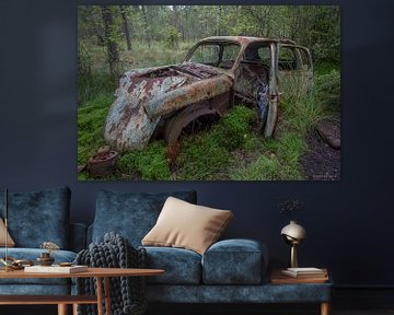 Car cemetery in forest in Ryd, Sweden by Joost Adriaanse