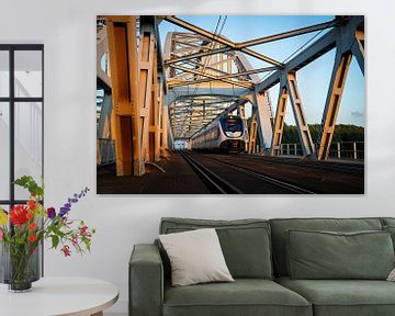 A Sprinter train crosses the railway bridge between Weesp and Diemen. by Stefan Verkerk