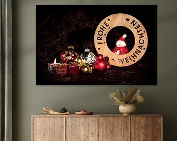 "Merry Christmas" with figure, Christmas tree balls and candle in front of brown velvet ba