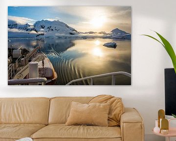 Silently gliding with a setting sun through Paradise Bay in Antarctica by Thijs van den Burg