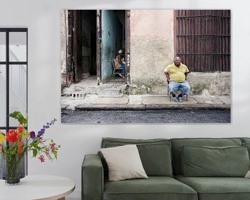 Cuban man in front of his house in Havana, Cuba by Tjeerd Kruse