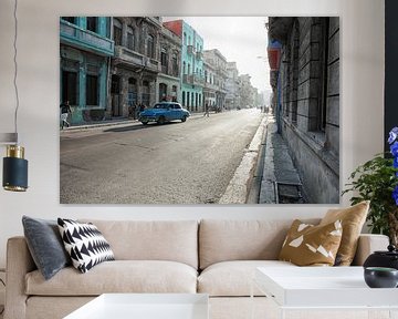 Typical street scene with people and colorful buildings. Havana