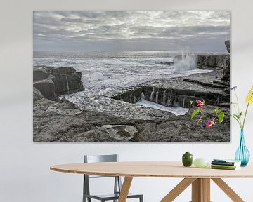 Sea cliffs hole in the rock called The Wormhole at Aran Islands, Ireland by Tjeerd Kruse