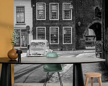 Classic French Citroën 2CV car on a snowy street during in the old town by Sjoerd van der Wal Photography