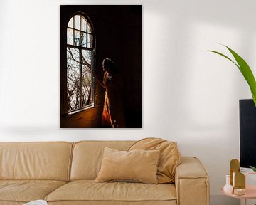 Woman in front of window of ghost town Kolmanskop by Maartje Kikkert