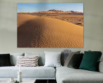 desert garden background on a blue sky. Mountains and hills of colored sand, Sahara Africa.