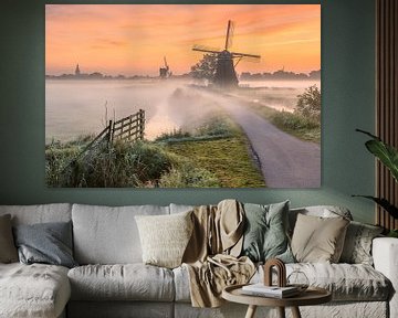 Mills in the fog during sunrise at Streefkerk