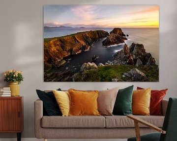 rugged rocky coast in the soft evening light by Daniela Beyer