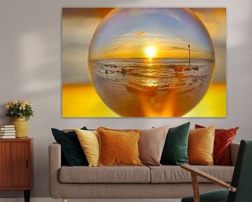 Ondergaande zon in lensbol