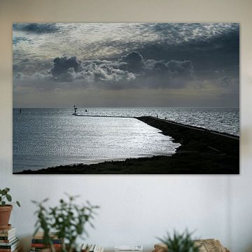 Impressive clouds above the walking pier of the village of West Terschelling on the island of Tersch