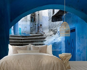 Soccer player in Chefchaouen, Morocco by Paula Romein