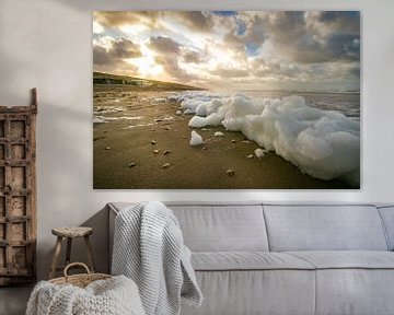 Sea foam on a North Holland beach during a stormy winter morning by Arthur Puls Photography