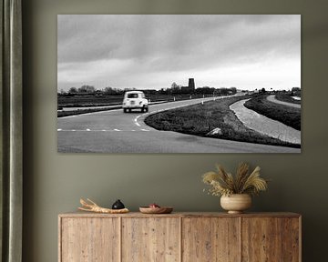 An old-timer driving along the meadows just outside Amsterdam by Guido Boogert