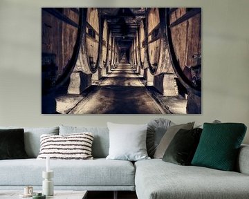 authentic wine cellar with old wine barrels by eric van der eijk