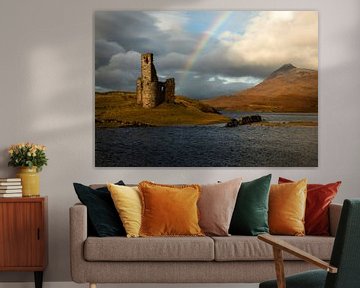 Ardvreck castle on Loch Assynt in Scotland with a beautiful rainbow by Jos Pannekoek