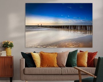 typical breakwater of wooden poles along the coast of Zeeland by gaps photography