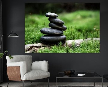 stacked stones of basalt in the forest surrounded by moss by Jürgen Wiesler