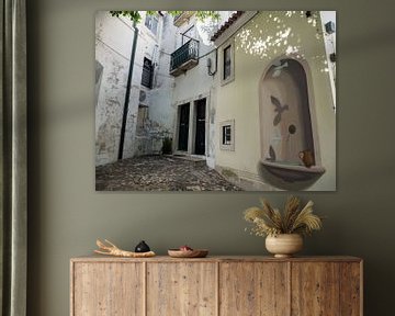 Little square with a fountain in an alleyway in Lisbon by Sofie Duchateau