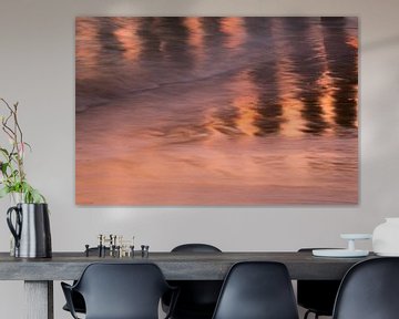 reflection of poles in the sea in evening light by Ria Bloemendaal