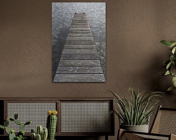 Wooden jetty on the frozen Loosdrecht lakes in winter by Jan van Dasler