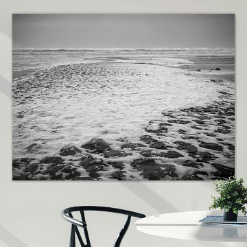 Pier with foam at the beach resort Callantsoog