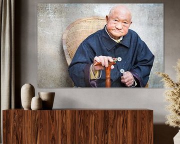 Portrait old man posing with walking stick in China by Ger Beekes