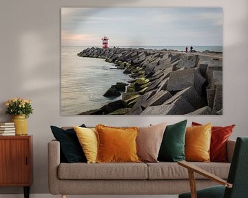 Cyclists at the harbour's breakwater in Scheveningen by OCEANVOLTA