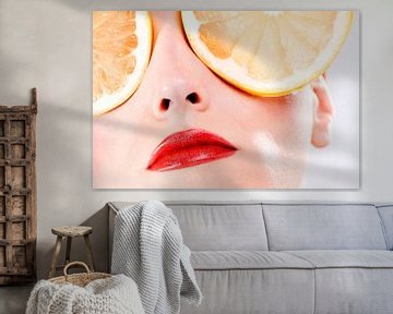 SF00989776 Women's face with eyes covered with orange slices by BeeldigBeeld Food & Lifestyle